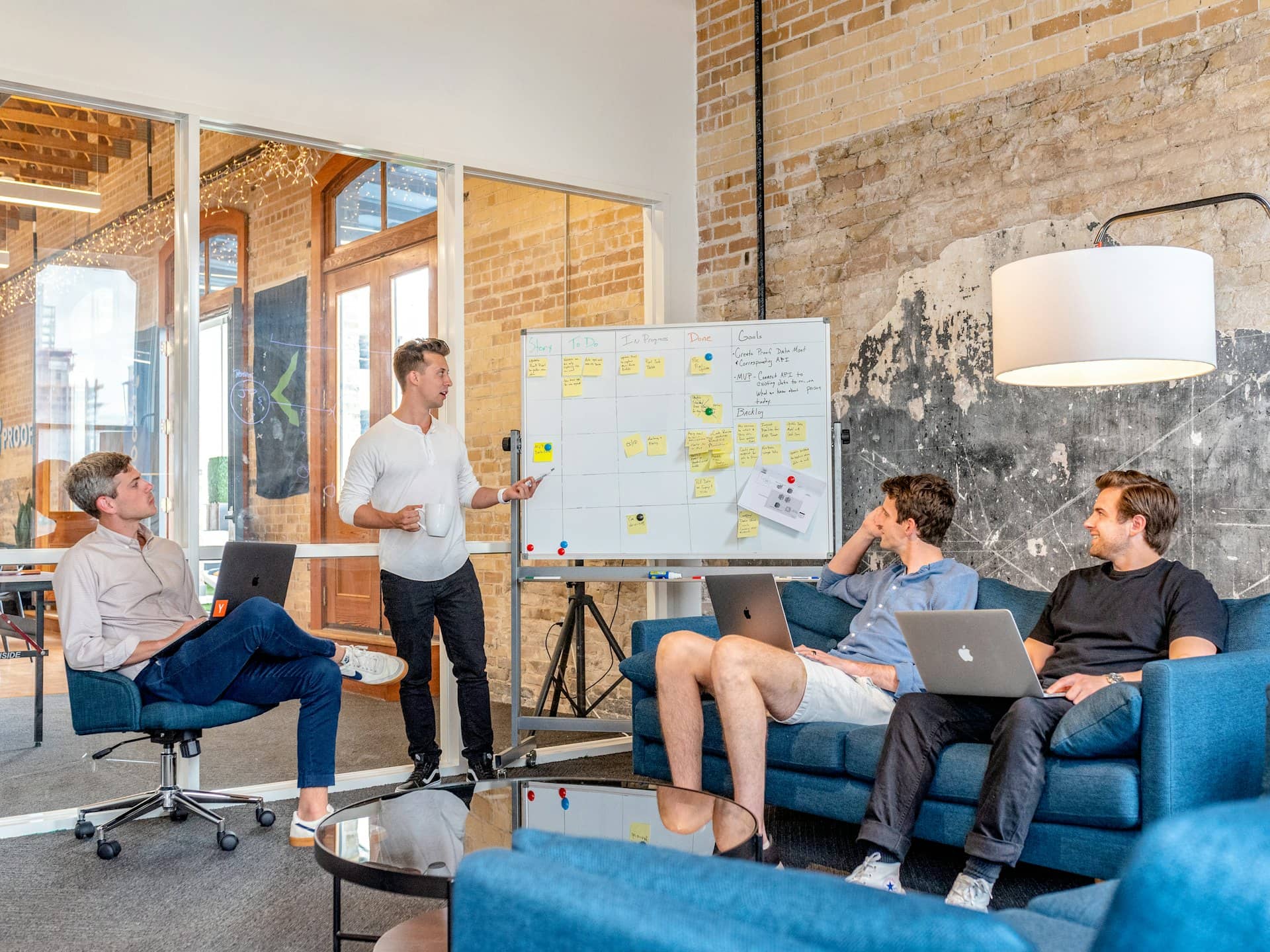 Team mapping a business workflow at a whiteboard